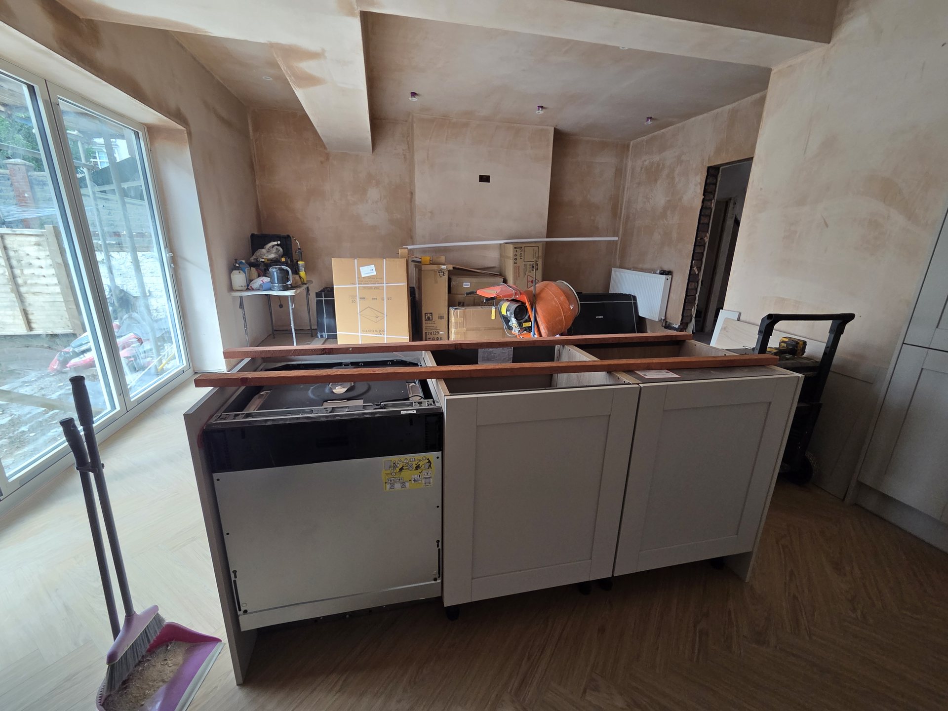 Kitchen cabinetry fitted, plastering complete